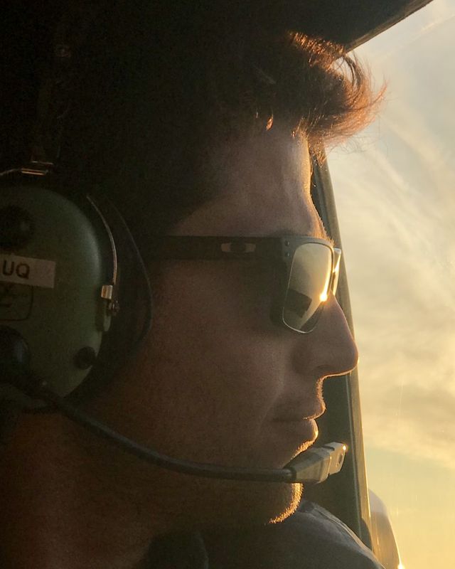 Joey Wolf, founder, in a helicopter